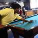 Ypsilanti Community Schools senior Antoino Webster plays a round of pool during the Student Engagement Summit at the Neutral Zone on Friday, August 23, 2013. Melanie Maxwell | AnnArbor.com